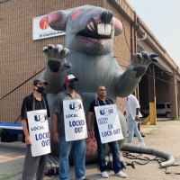 Locked-out NRI workers with Scabby the Rat